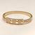 Gold-tone medusa bangle bracelet with crystal accents