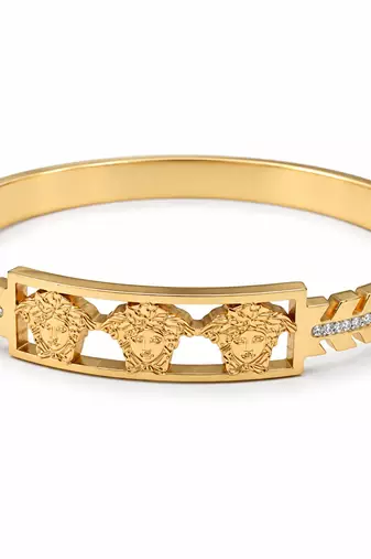 Gold-tone medusa bangle bracelet with crystal accents