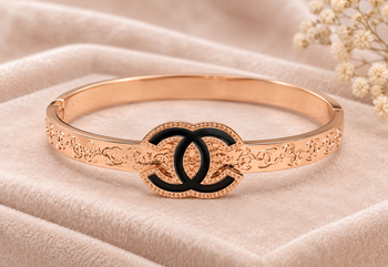 Rose gold bangle bracelet with black enamel cc motif 1