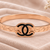 Rose gold bangle bracelet with black enamel cc motif