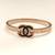 Rose gold bangle bracelet with black enamel cc motif