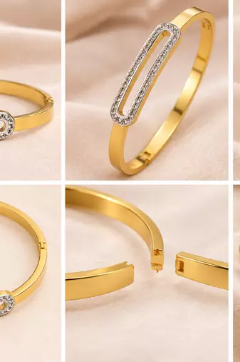 Gold-tone bangle bracelet with crystal oval centerpiece