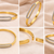 Gold-tone bangle bracelet with crystal oval centerpiece