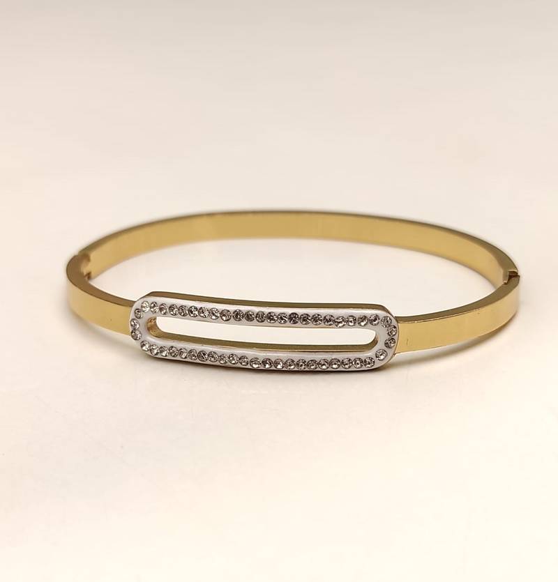 Gold-tone bangle bracelet with crystal oval centerpiece