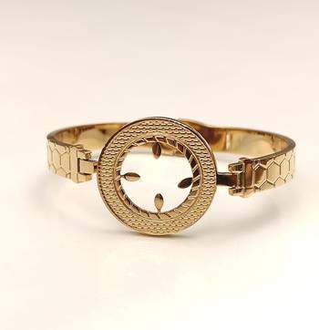 Gold-toned bangle bracelet with circular medallion & floral cutout 4