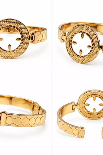 Gold-toned bangle bracelet with circular medallion & floral cutout