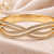 Gold-tone crystal pave infinity bangle bracelet for women