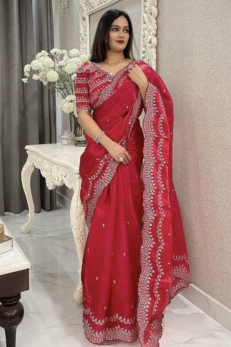 red embroidered saree with blouse piece
