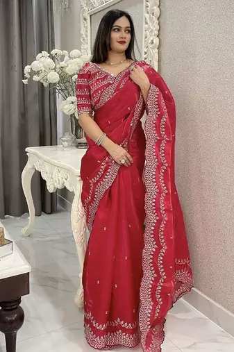 red embroidered saree with blouse piece
