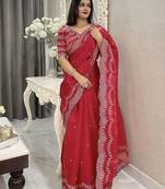 red embroidered saree with blouse piece