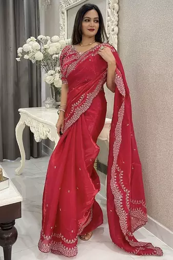 red embroidered saree with blouse piece
