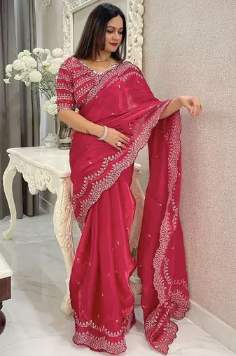 red embroidered saree with blouse piece