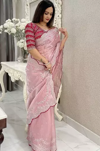 pink women ethnic motifs embroidered saree