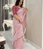 pink women ethnic motifs embroidered saree