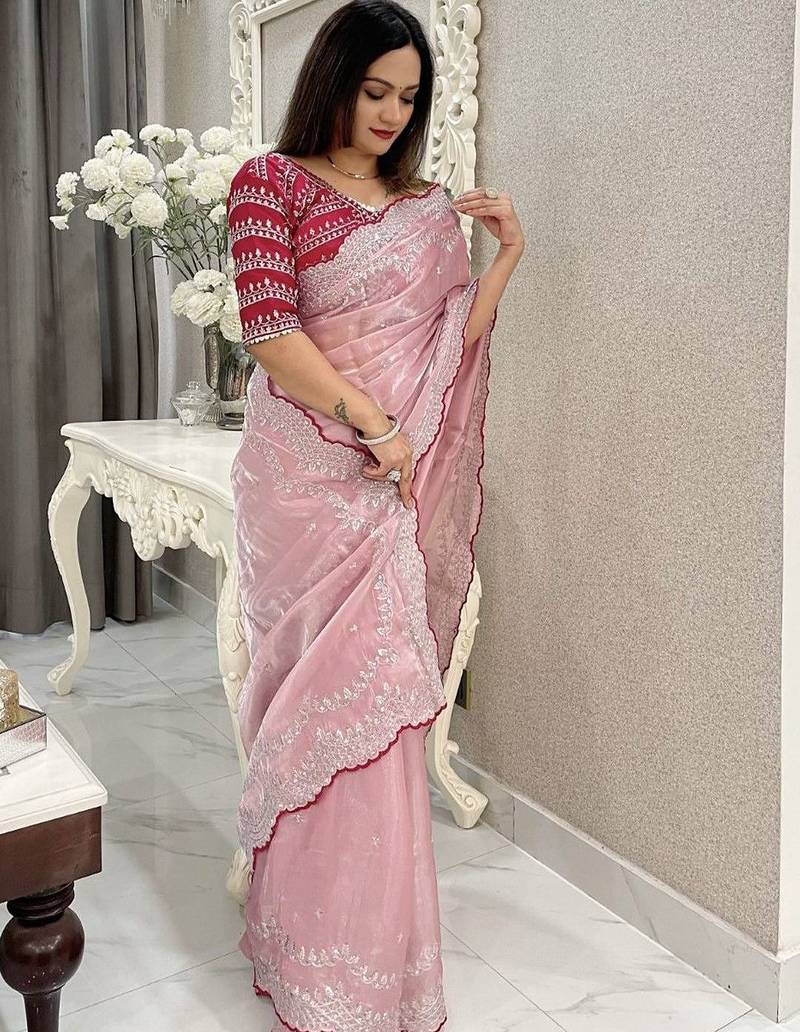 pink women ethnic motifs embroidered saree