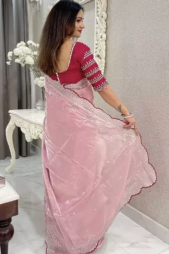 pink women ethnic motifs embroidered saree
