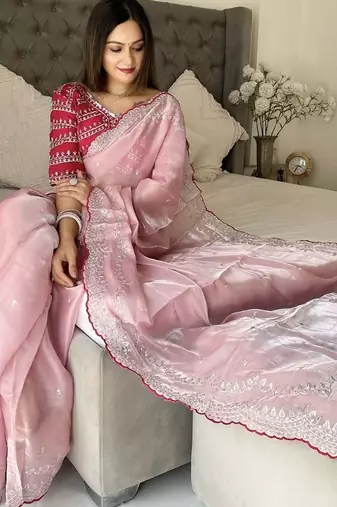 pink women ethnic motifs embroidered saree