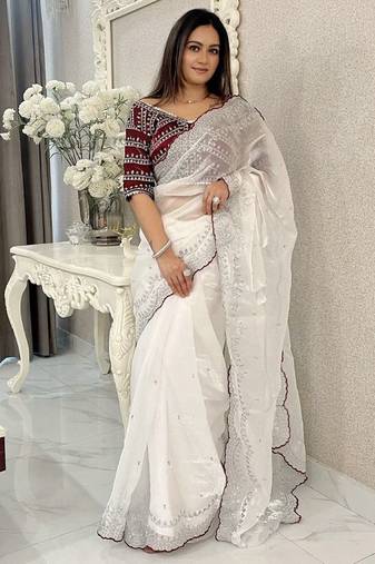 white ethnic motifs embroidered saree