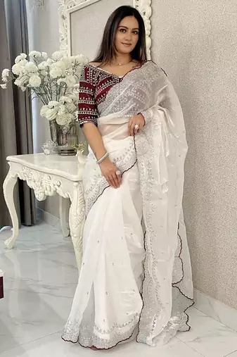 white ethnic motifs embroidered saree