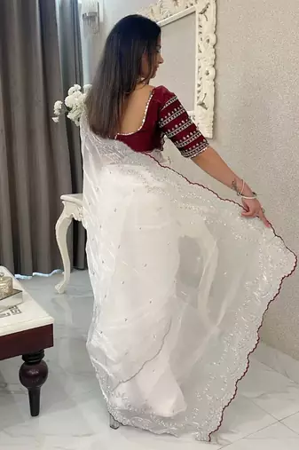 white ethnic motifs embroidered saree