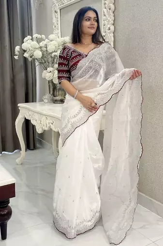 white ethnic motifs embroidered saree