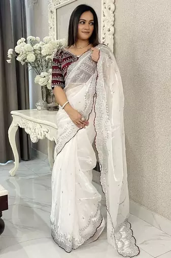 white ethnic motifs embroidered saree