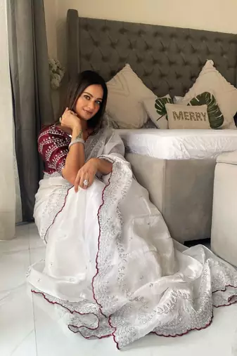 white ethnic motifs embroidered saree