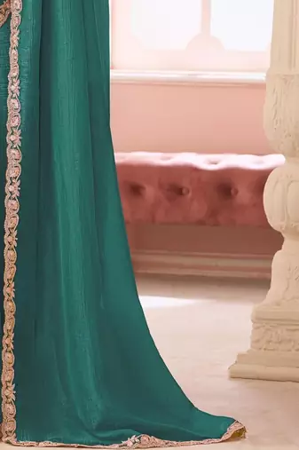 teal embellished sequinned pure georgette saree