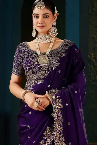 Purple ethnic motifs zari heavy work saree