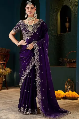 Purple ethnic motifs zari heavy work saree