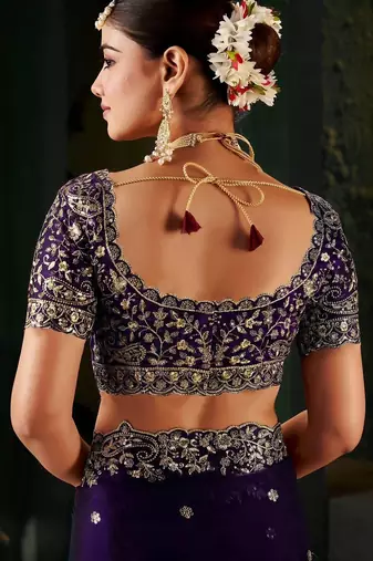 Purple ethnic motifs zari heavy work saree