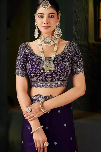 Purple ethnic motifs zari heavy work saree