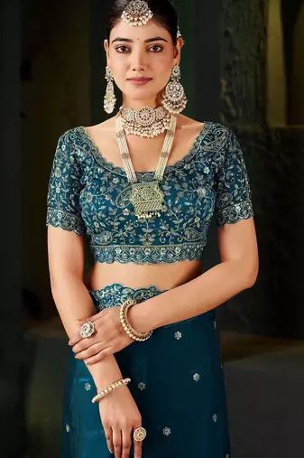 teal floral embroidered heavy work saree