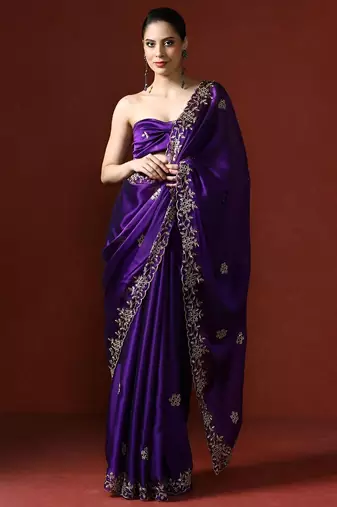 Purple ethnic motifs embroidered sequinned saree