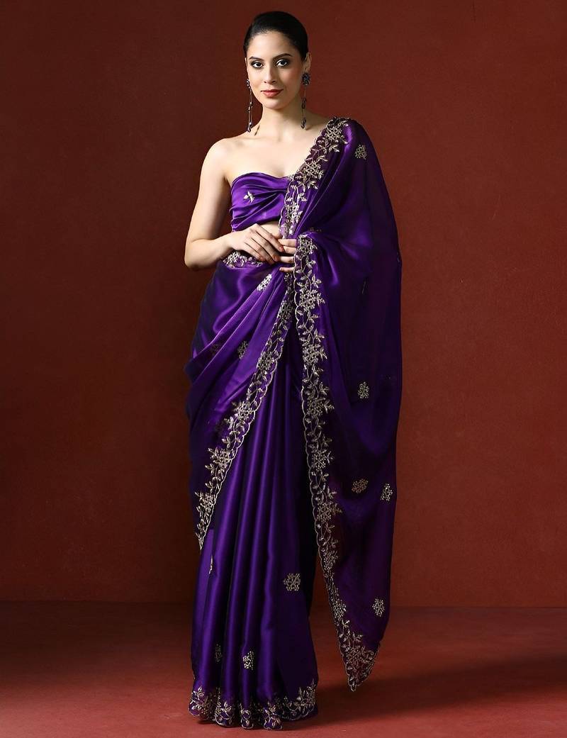 Purple ethnic motifs embroidered sequinned saree