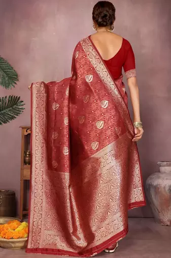 Maroon ethnic motifs woven design zari heavy work saree