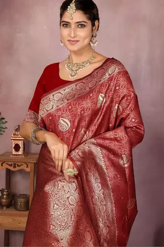 Maroon ethnic motifs woven design zari heavy work saree