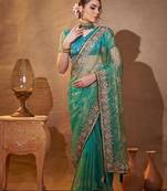 turquoise ethnic motifs embroidered tissue saree with unstitched blouse piece