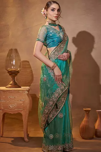 turquoise ethnic motifs embroidered tissue saree with unstitched blouse piece