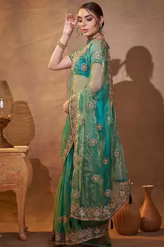 turquoise ethnic motifs embroidered tissue saree with unstitched blouse piece