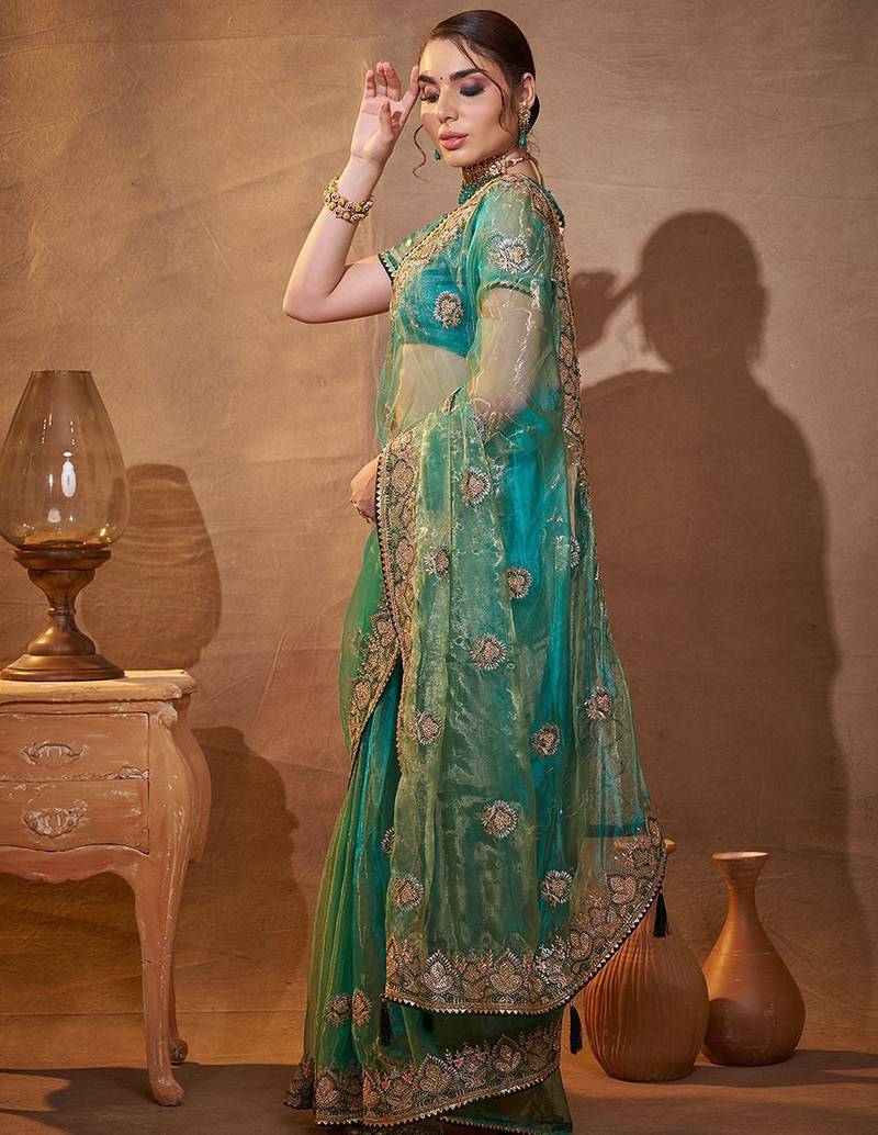 turquoise ethnic motifs embroidered tissue saree with unstitched blouse piece