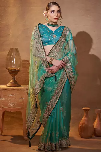 turquoise ethnic motifs embroidered tissue saree with unstitched blouse piece