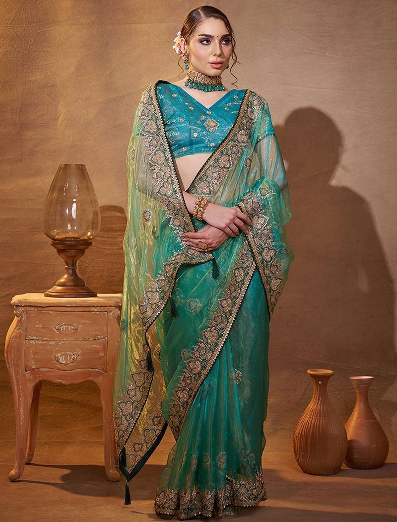 turquoise ethnic motifs embroidered tissue saree with unstitched blouse piece