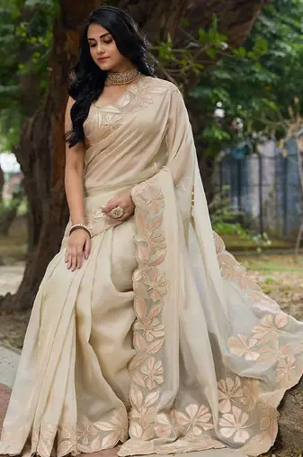 cream embellished sequinned organza saree