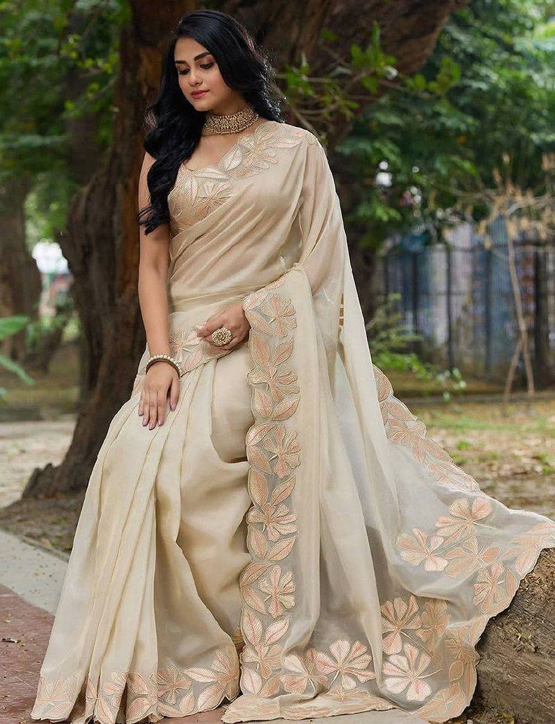 cream embellished sequinned organza saree