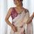 Cream floral printed mirror work saree