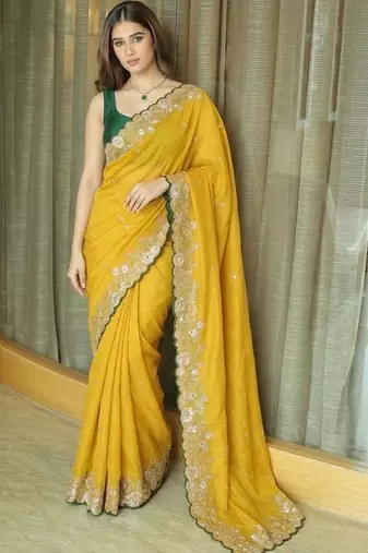 Yellow ethnic motifs embroidered pure chiffon saree
