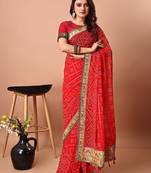 red women embroidered bandhani saree