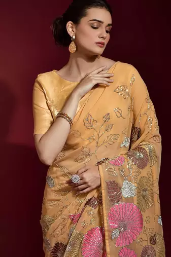 peach ethnic motifs embroidered sequinned poly georgette saree