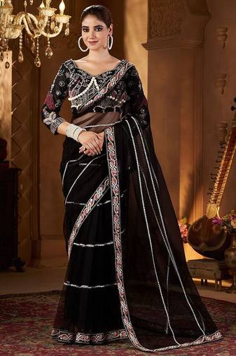 Black women embellished sequinned net saree